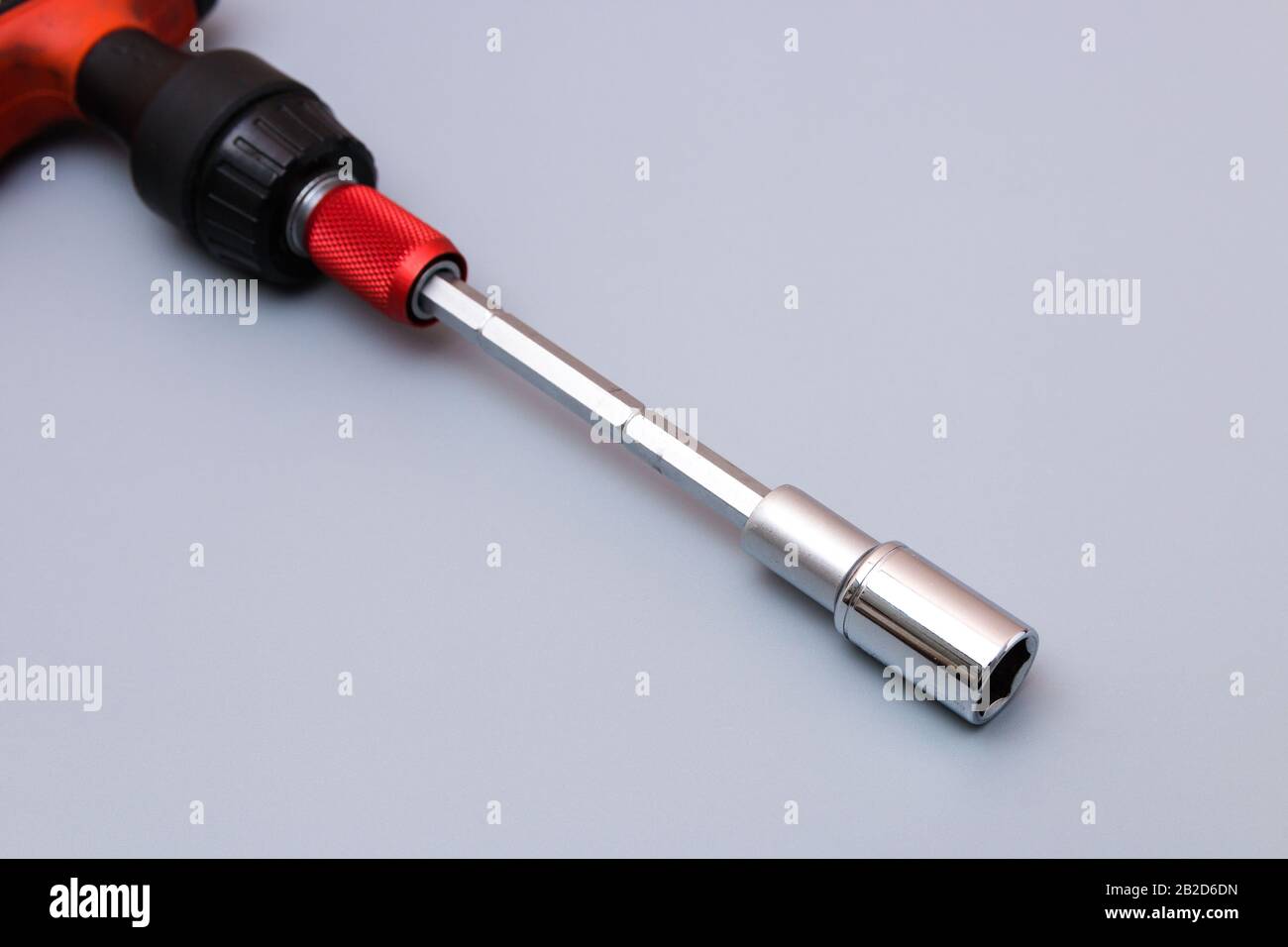 adjustable spanners set with red holder over a grey background. father