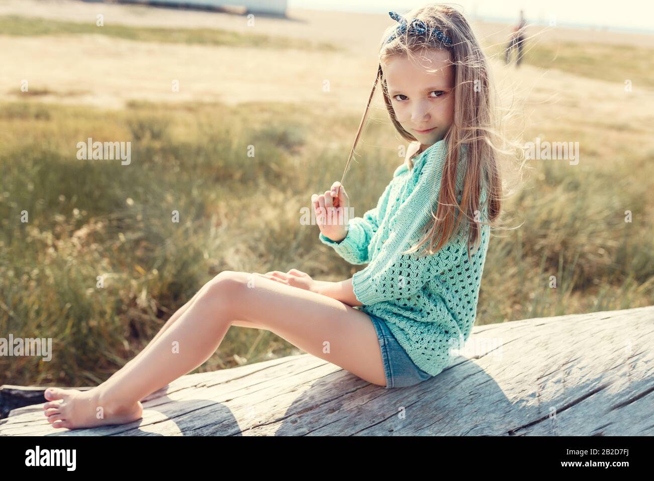 Pretty Little Girl Relaxing On The Beach Near Sea Summer Vacation Travel Concept Smiling Cute Little Girl On Beach Vacation Stock Photo Alamy