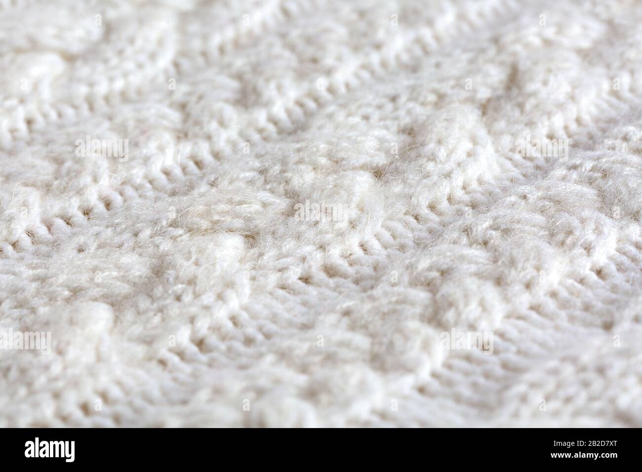 Knitted warm white winter sweater. Huggy style Stock Photo