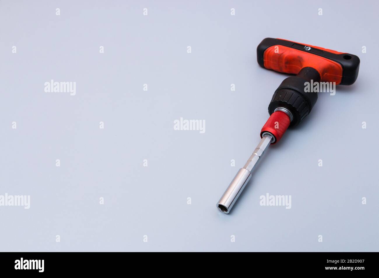 adjustable spanners set with red holder over a grey background. father
