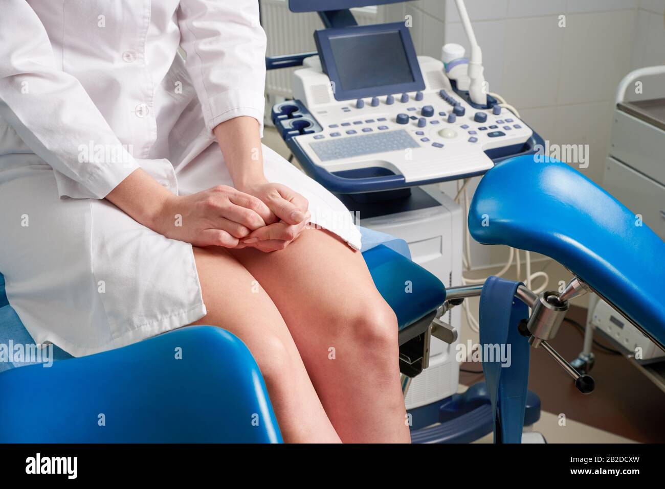 Woman At Gynecologist Office Sitting And Waiting For A Doctor With Test