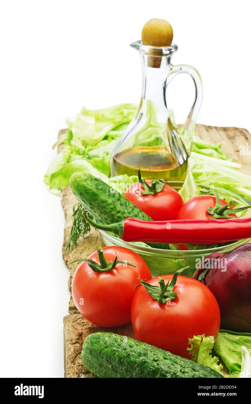 Set vegetable and jug of vegetable oil isolated on the white background