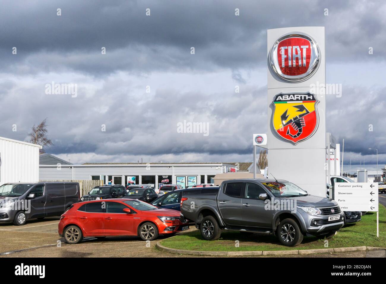 Cars for sale on the forecourt of a Fiat Abarth dealership. Stock Photo