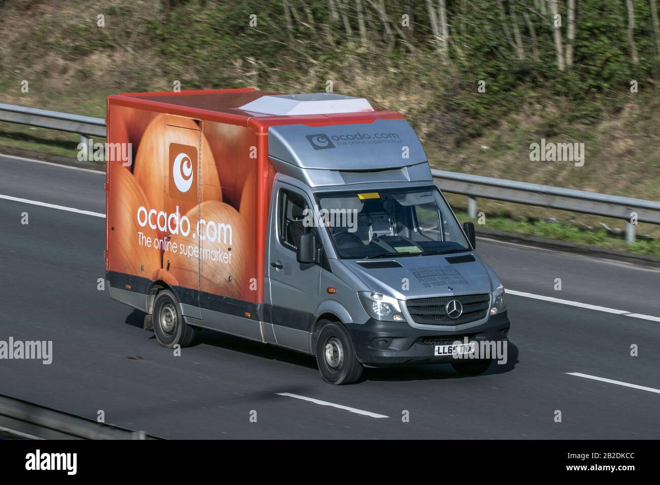 Ocado food delivery grocery van driving on the M6 motorway near Preston