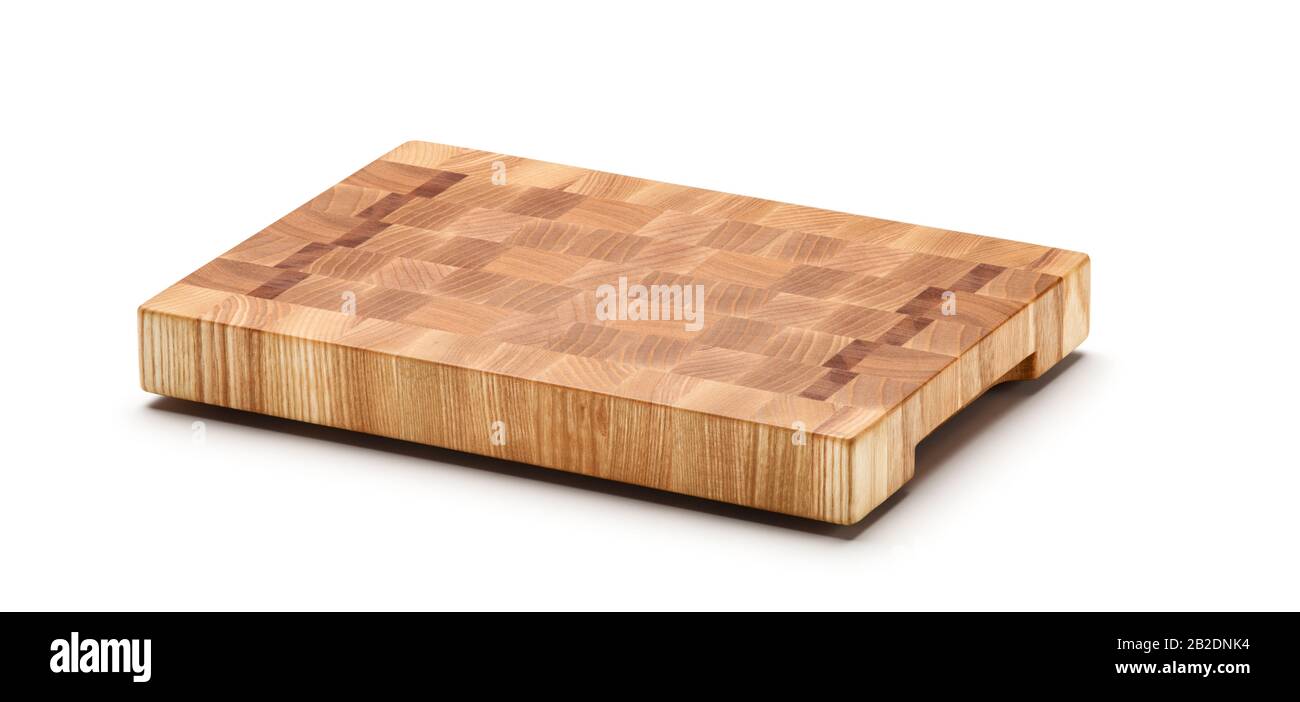 Butcher wood block cutting board isolated over white background. Large Depth of Field. Stock Photo