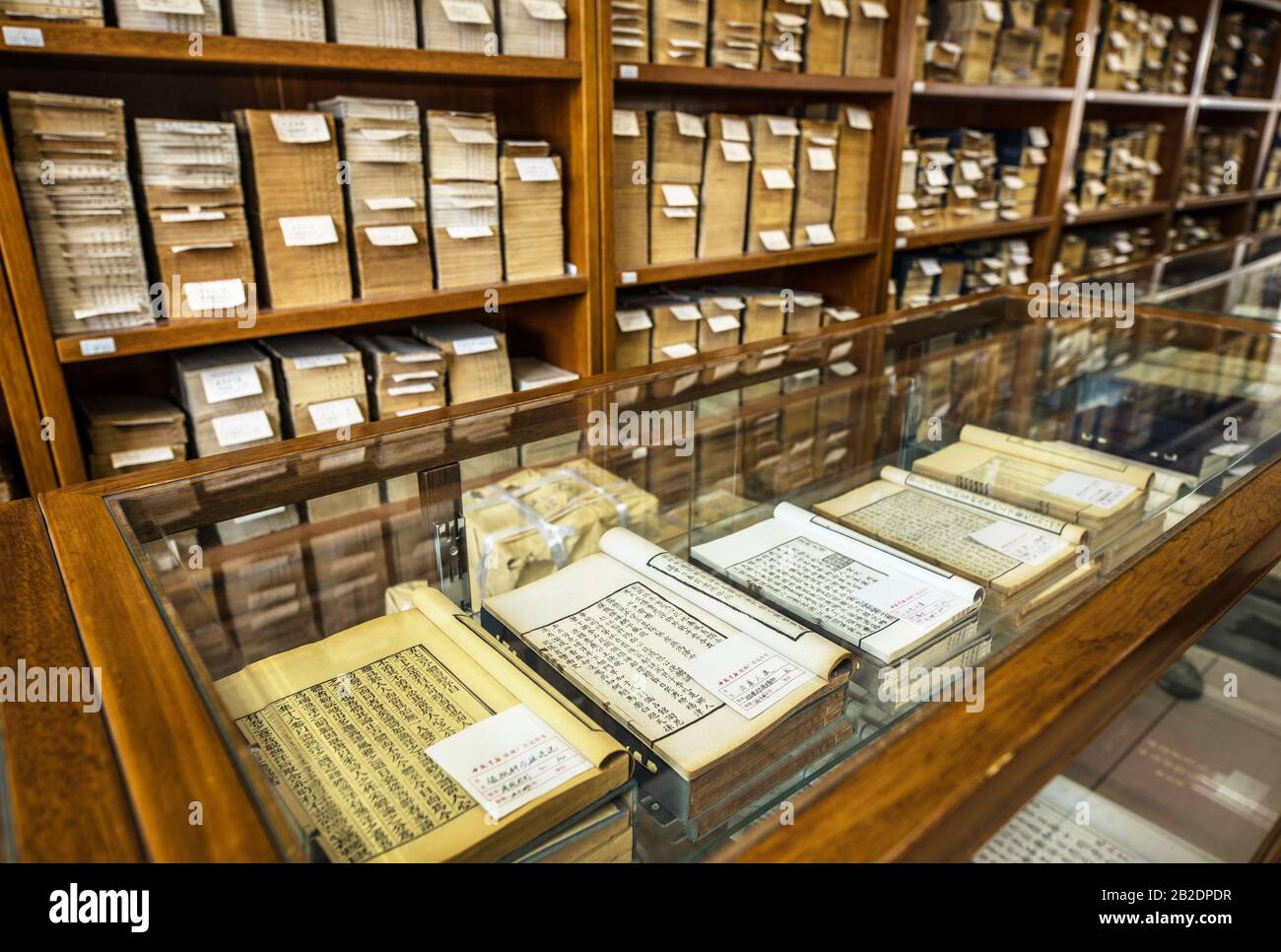BEIJING, СHINA JUNE 01, 2019 Traditional Chinese library with shelves of old and modern books