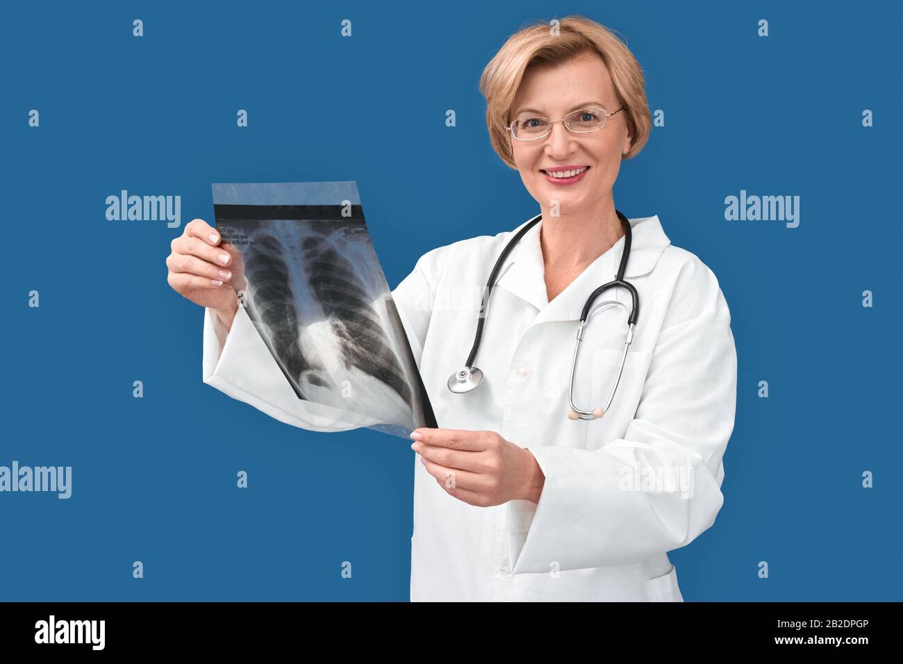 Medicine Concept, Woman doctor in white rob and glasses standing ...