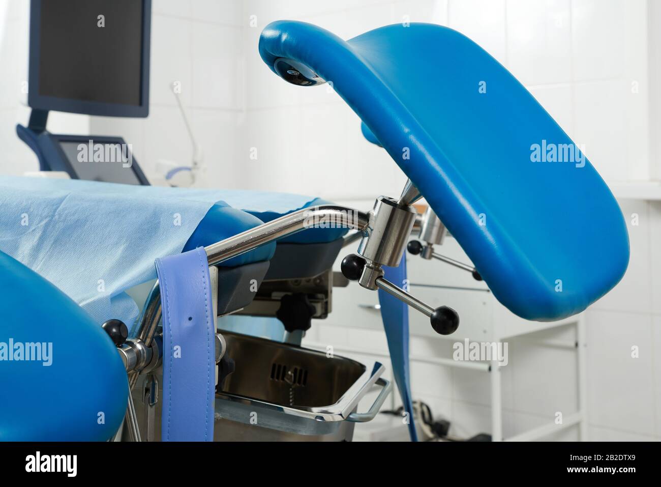Gynecological room with chair and equipment Stock Photo - Alamy