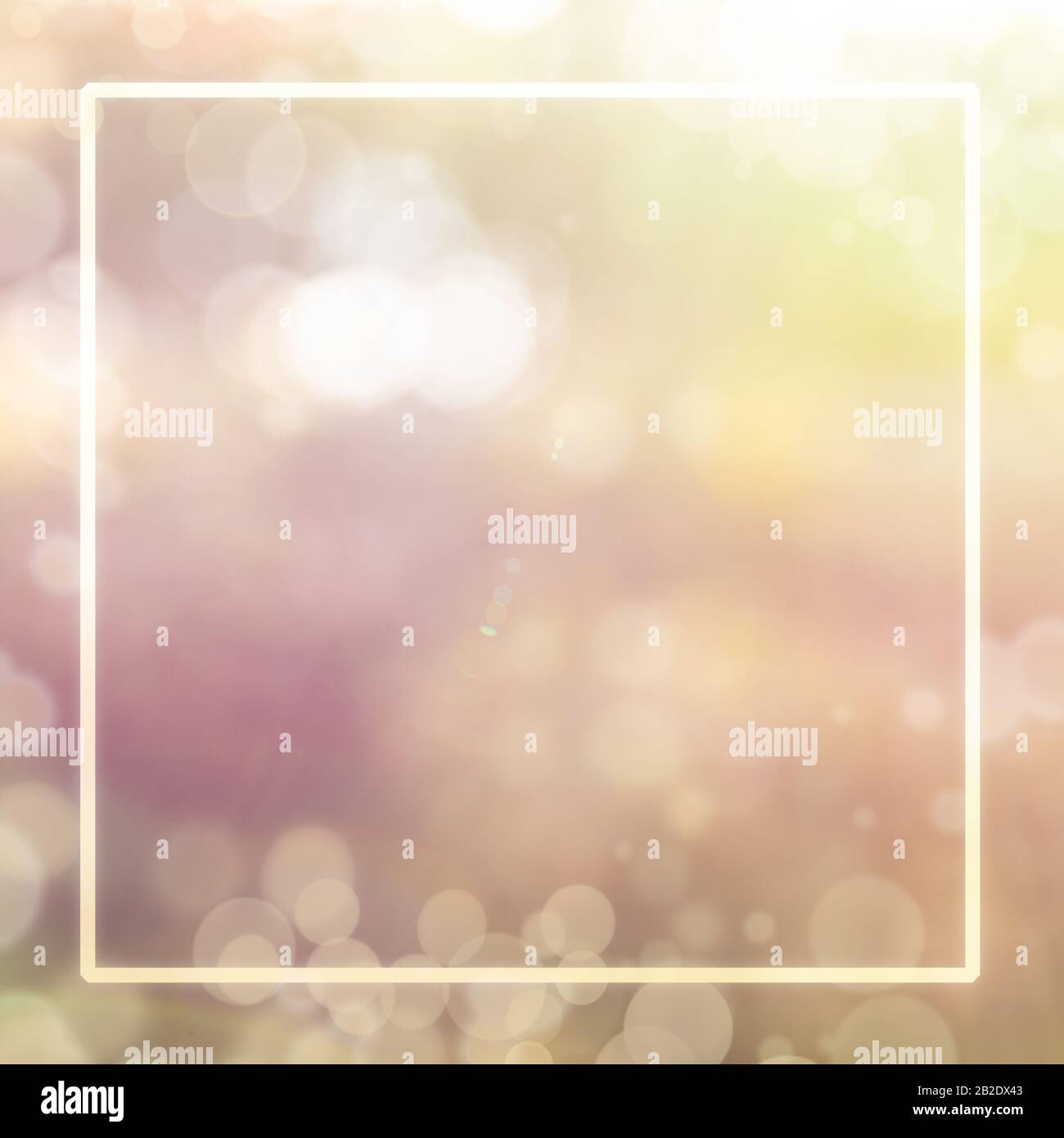 Blurred nature background with lens flare bokeh and square frame for
