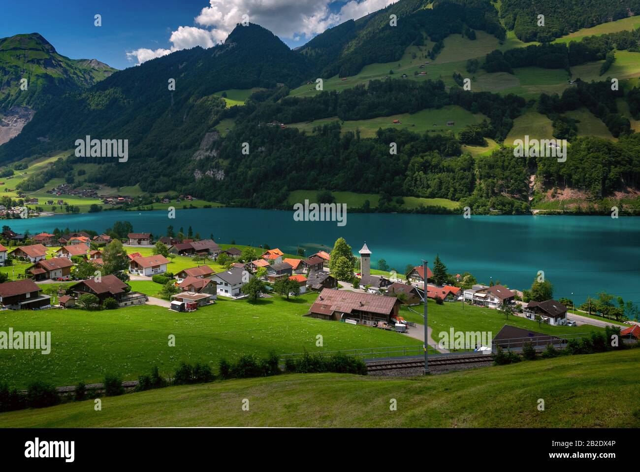 Swiss village Lungern with its traditional houses and old church tower