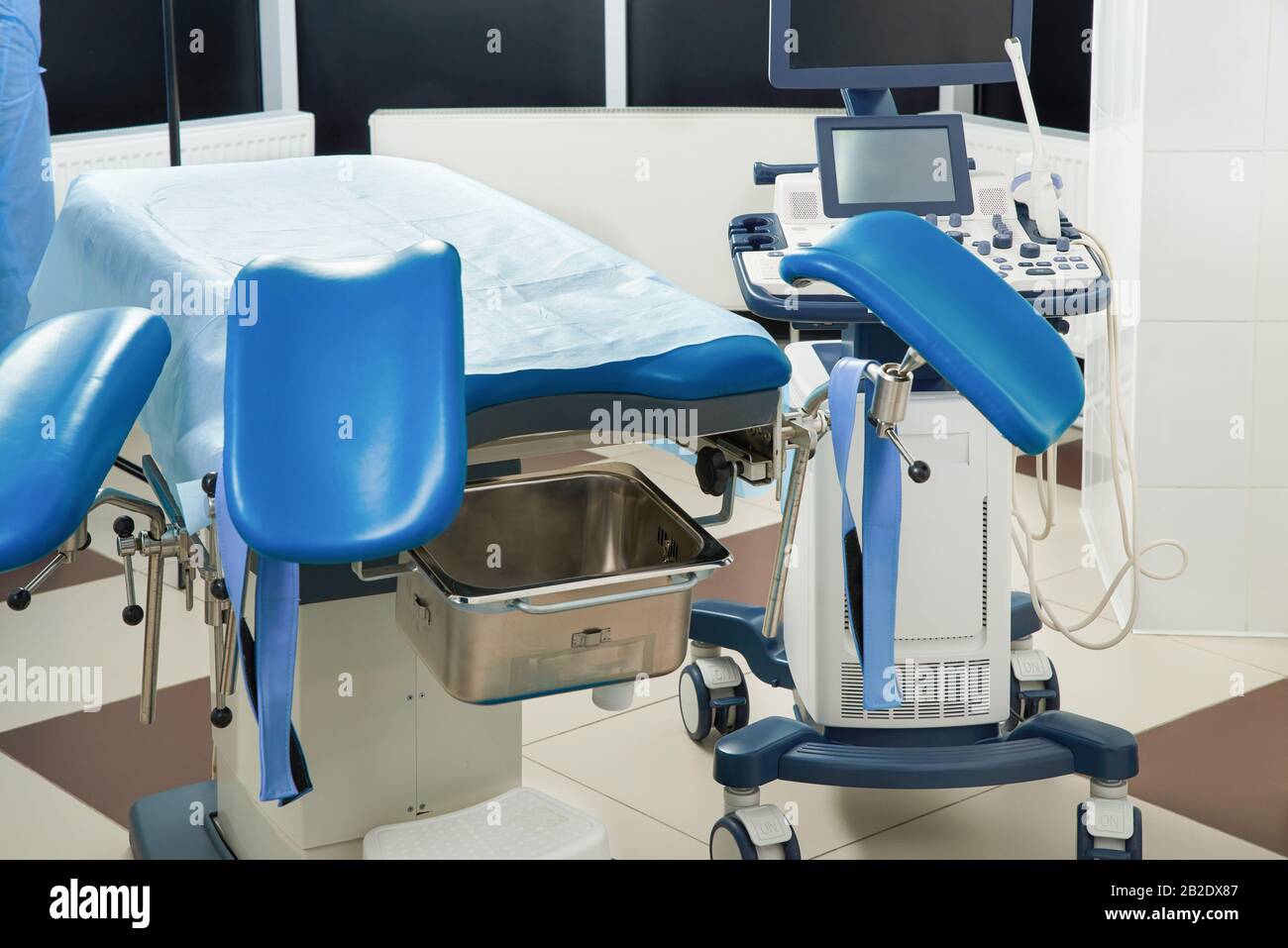Gynecological room with chair and equipment Stock Photo - Alamy