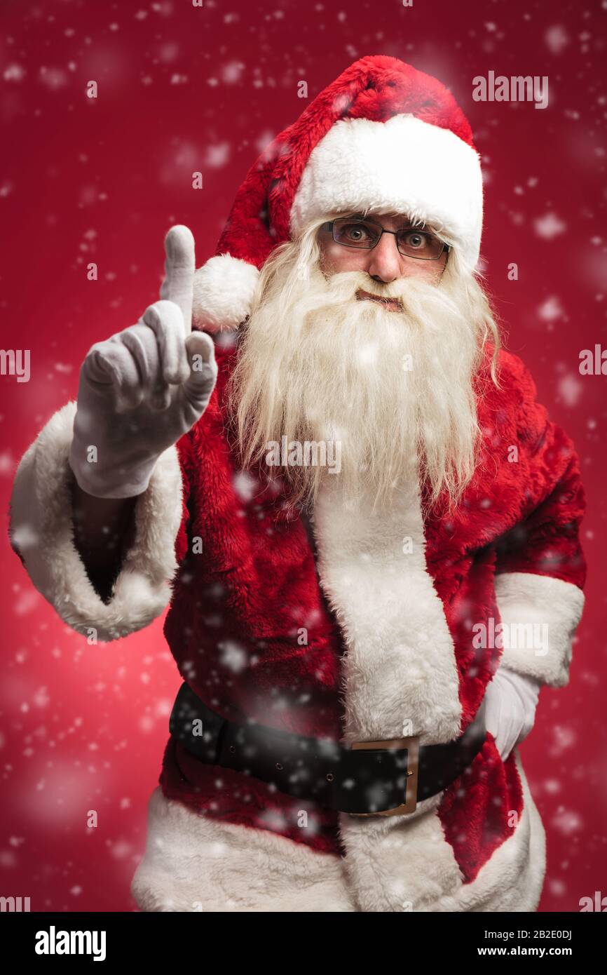 attention! santa claus is warning all the bad kids on red 