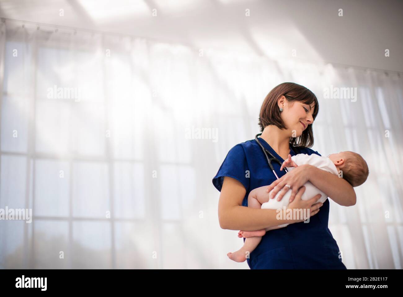 Holding child nurse hi-res stock photography and images - Alamy