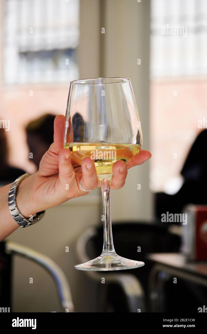 Lady holding a glass of wine hi-res stock photography and images - Alamy