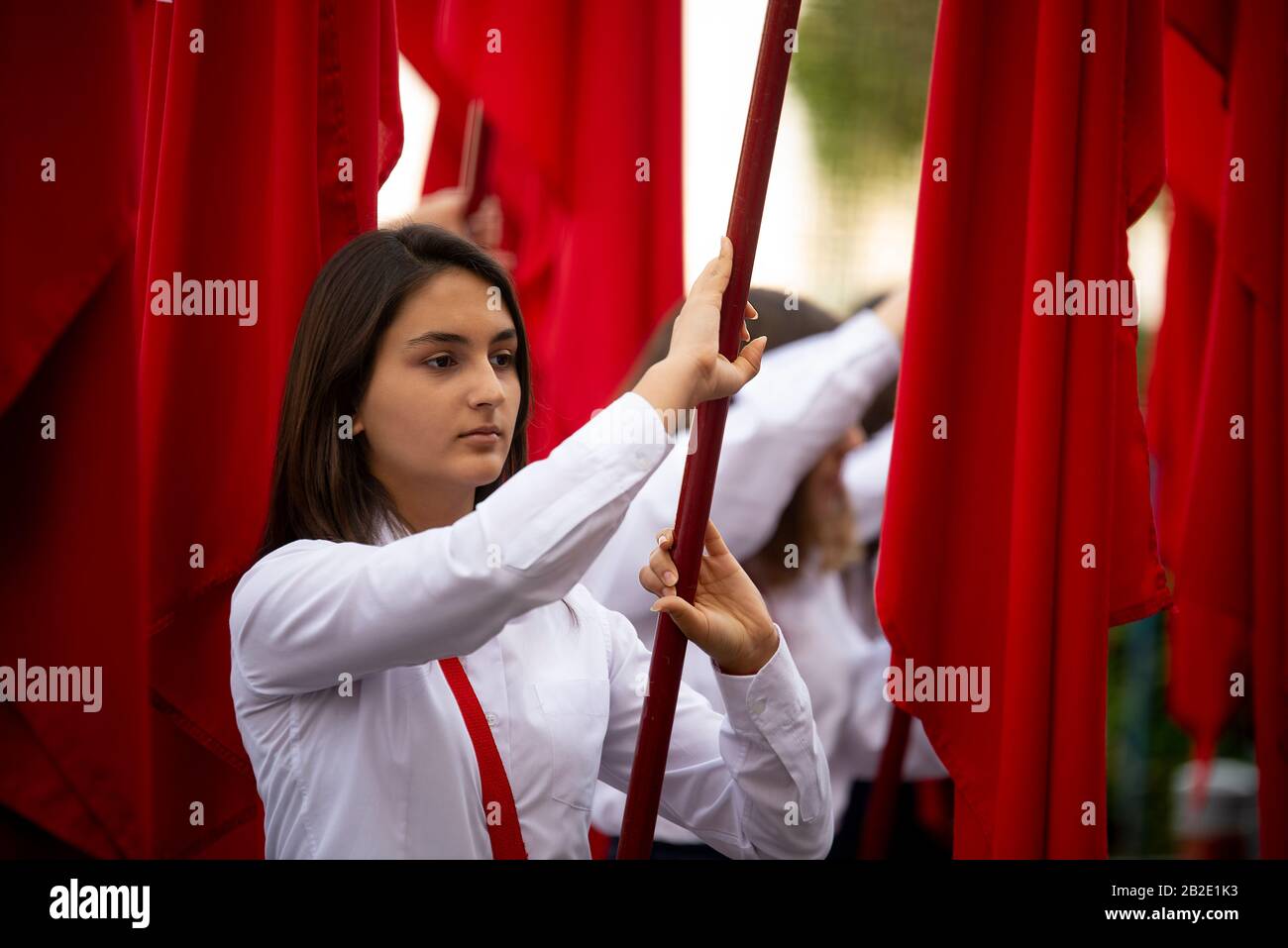 Izmir, Turkey October 29, 2016. Red Turkish flags and young female