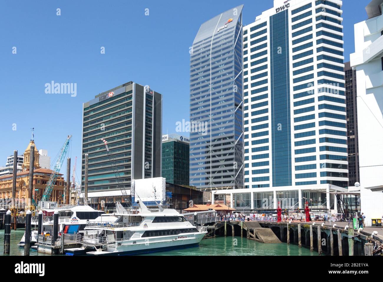 Ferry boats and downtown buildings from Princes Wharf, Auckland Waterfront, City Centre, Auckland, Auckland Region, New Zealand Stock Photo