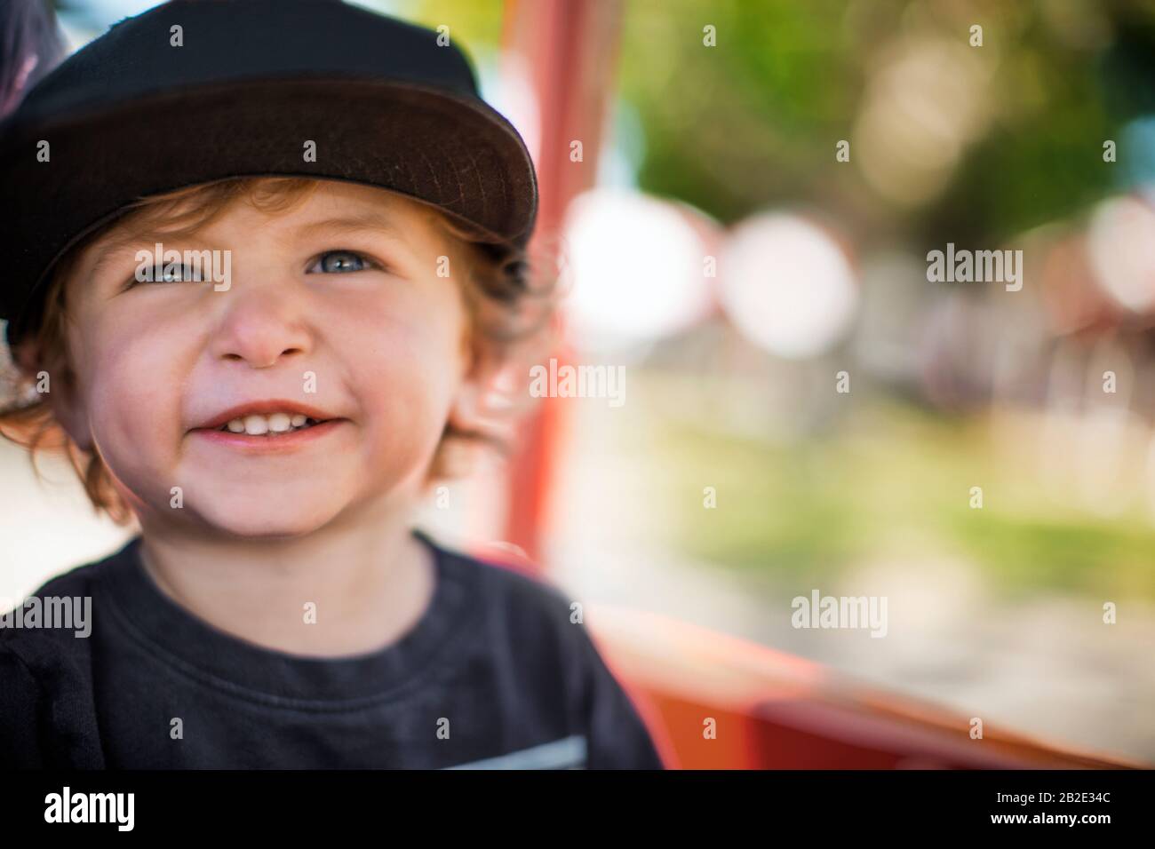 Young boy wearing a baseball cap Stock Photo Alamy