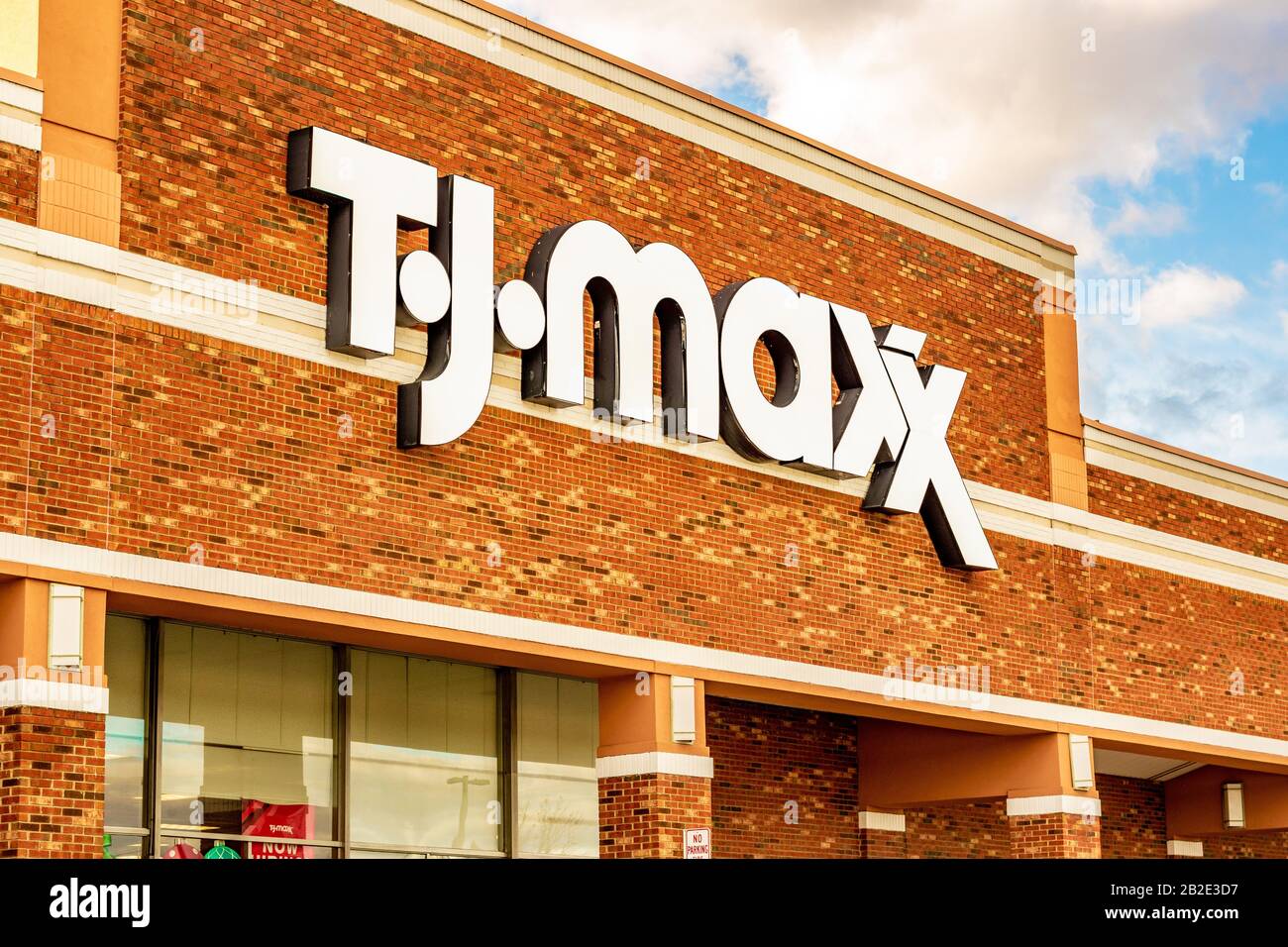 Charlotte, NC/USA - December 14, 2019: Medium horizontal closeup of 'T.J. Maxx' store facade showing brand in bold white letters on a brick building. Stock Photo