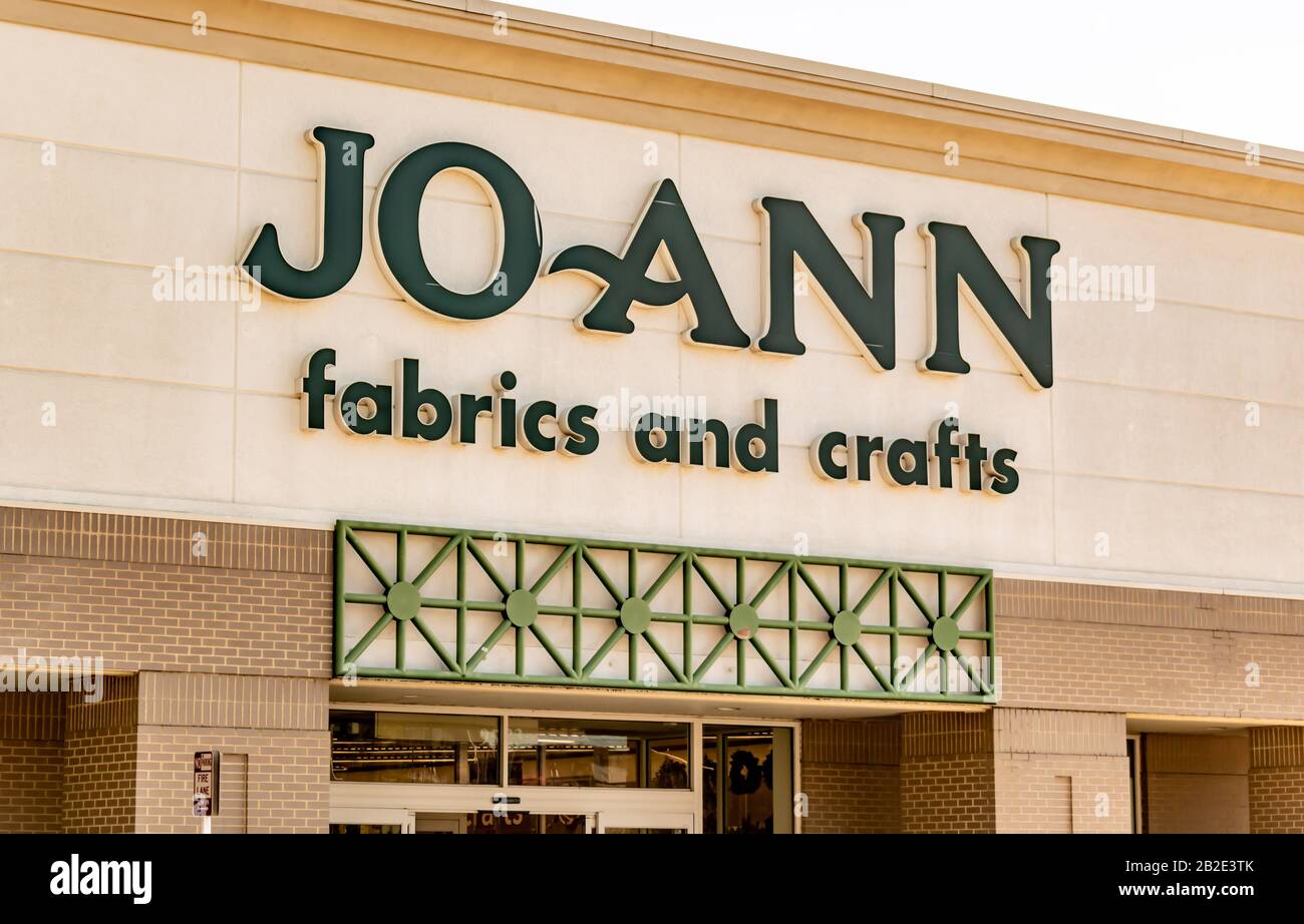 Charlotte, NC/USA - November 9, 2019: Closeup exterior horizontal shot of 'Joann Fabrics and Crafts' retail chain storefront above entrance showing br Stock Photo