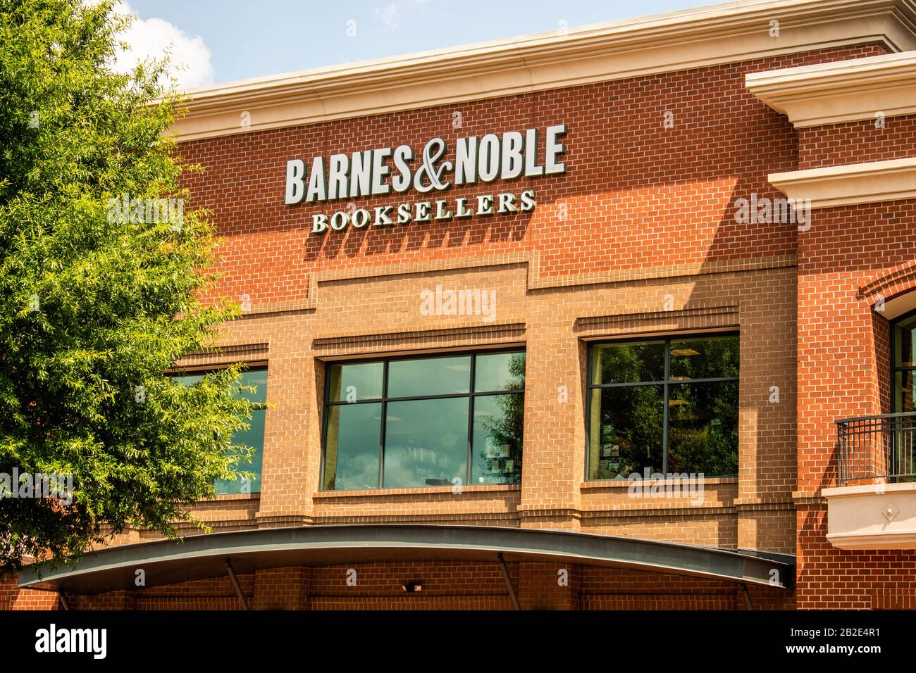 Charlotte, NC USA - July 7, 2019:  Horizontal, medium shot of 'Barnes & Noble Booksellers' exterior facade brand and logo signage on a sunny day. Stock Photo
