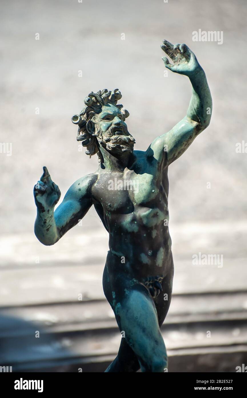 Bronze statue of the Dancing Faun at the House of the Faun, Pompeii, Italy Stock Photo