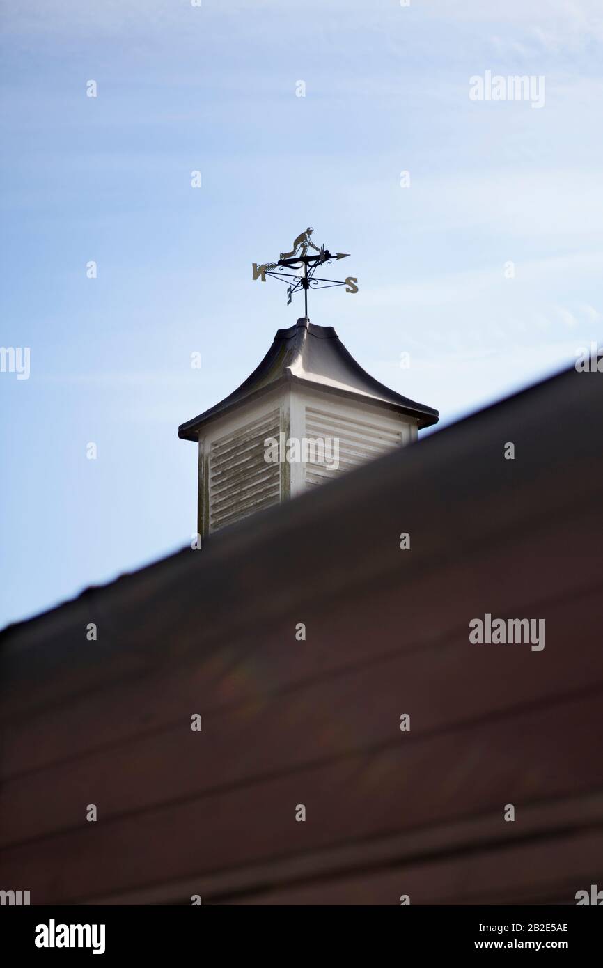 A weathervane featuring a bowler, on a bowls club in Bedfordshire. Stock Photo