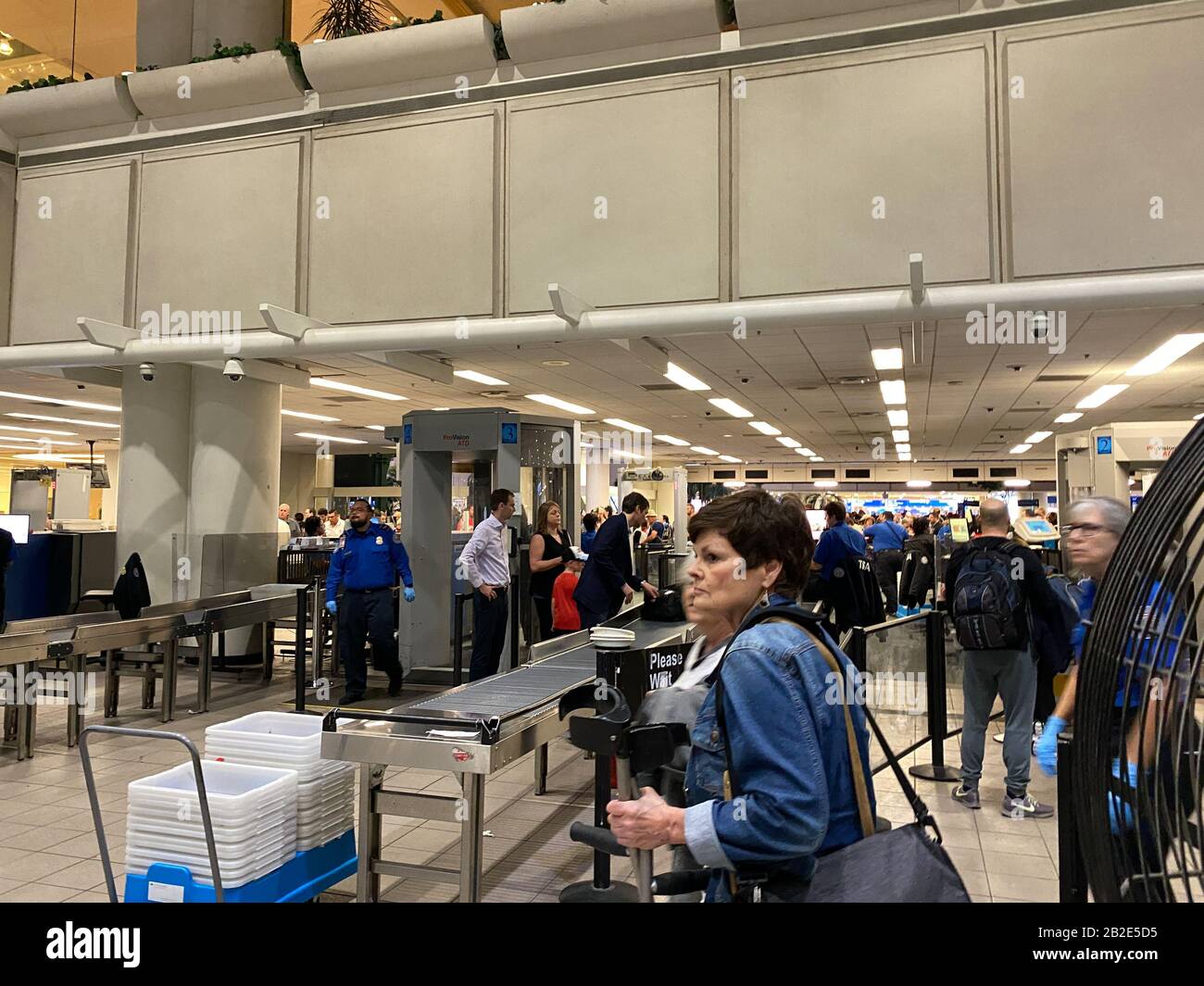 Orlando,FL/USA-2/27/20:  People going  through Orlando International Airport MCO TSA security on a busy day. Stock Photo