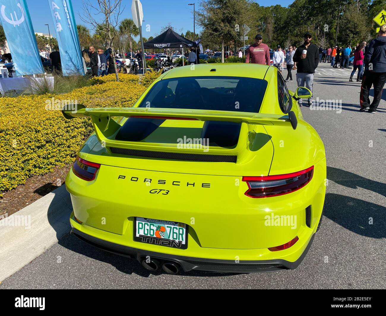 Orlando, FL/USA-3/1/20: The rearend of a bright green Porsche GT3 at a free car show in a retail store parking lot. Stock Photo
