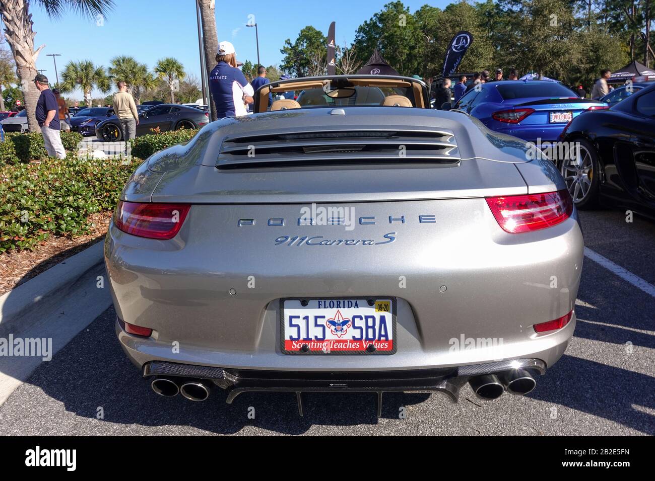 Orlando, FL/USA-3/1/20: The rearend of a silver gray Porsche Carrera S at a free car show in a retail store parking lot. Stock Photo