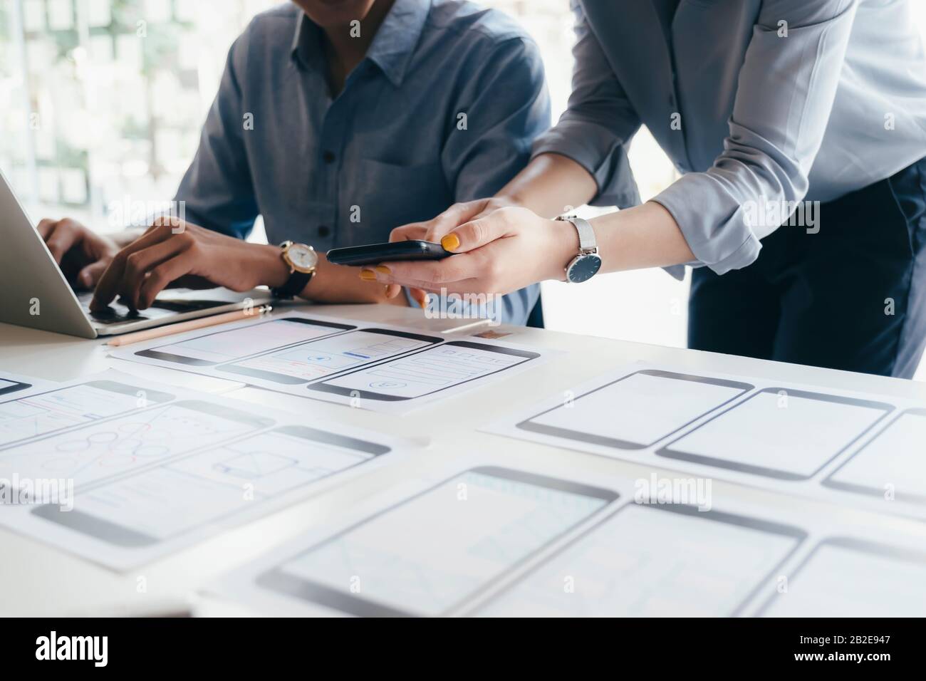 Programmer and UX UI designer working in a software development and coding technologies. Mobile and website design and programing development technolo Stock Photo