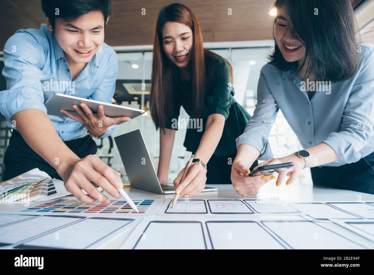 Programmer and UX UI designer working in a software development and coding technologies. Mobile and website design and programing development technolo Stock Photo