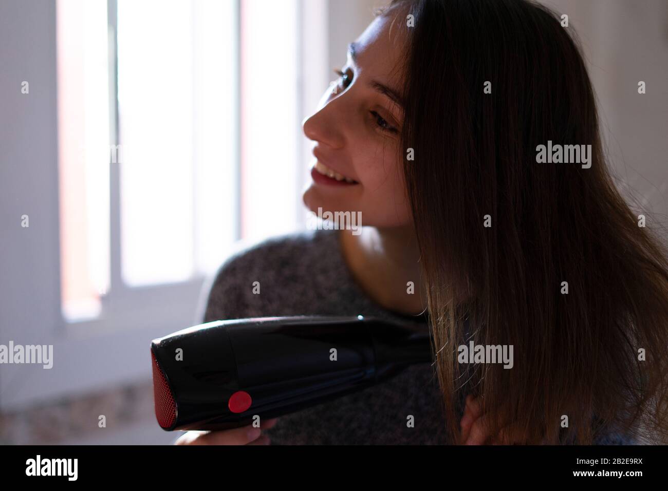 Hair dryer woman hi-res stock photography and images - Alamy