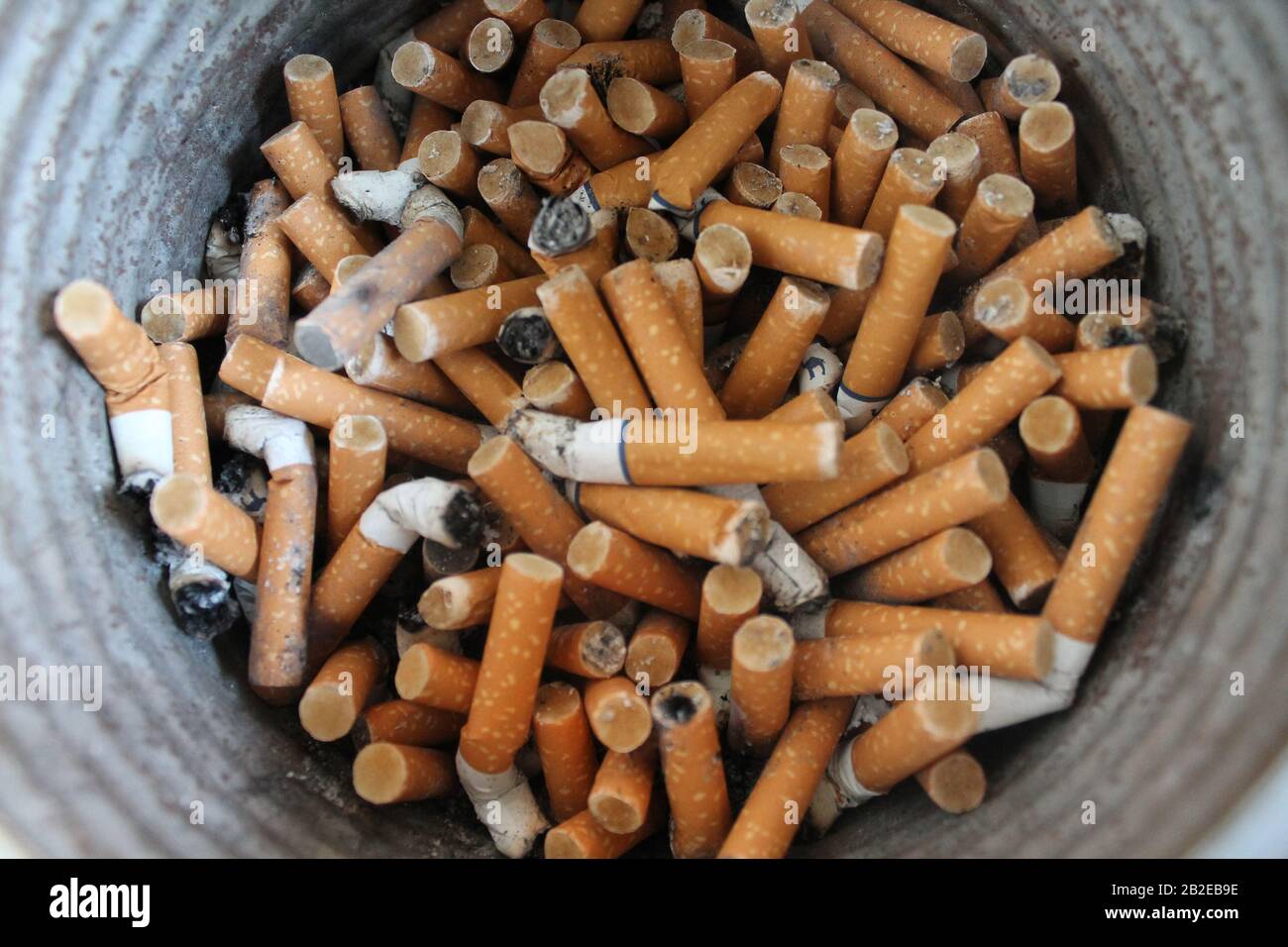 cigarette sand buckets Bucket of cigarette butts Stock Photo