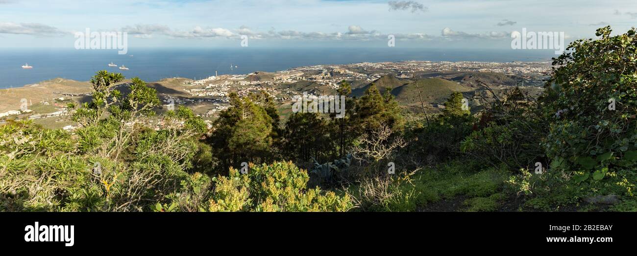 Super wide panorama. Aerial view from Bandama mountain peak to Caldera Bandama. Warm sunny day, bright blue sky and beautiful white clouds. Canary isl Stock Photo