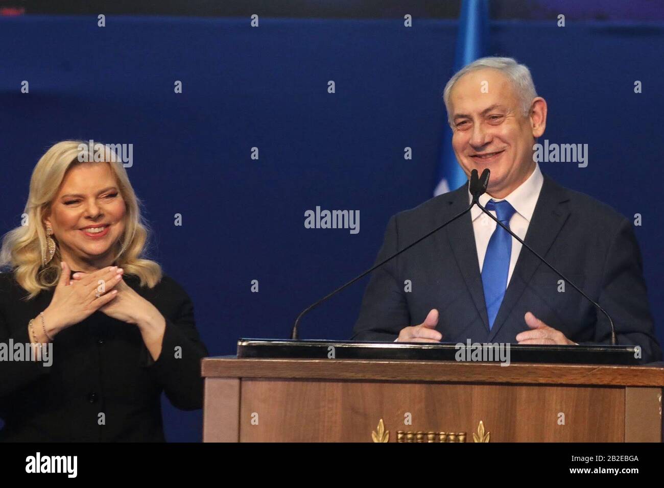 Tel Aviv, Israel. 03rd Mar, 2020. Israeli Prime Minister and Chairman of the Likud Party, Benjamin Netanyahu, stand next to his wife Sara as he addresses supporters following early exit polls. Credit: Ilia Yefimovich/dpa/Alamy Live News Stock Photo