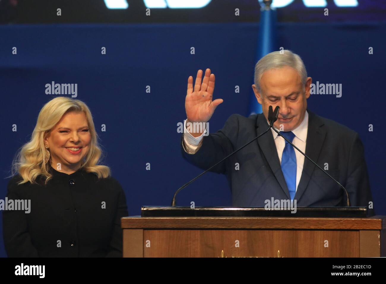 Tel Aviv, Israel. 03rd Mar, 2020. Israeli Prime Minister and Chairman of the Likud Party, Benjamin Netanyahu, gestures as he stands next to his wife Sara while addressing supporters following early exit polls. Credit: Ilia Yefimovich/dpa/Alamy Live News Stock Photo
