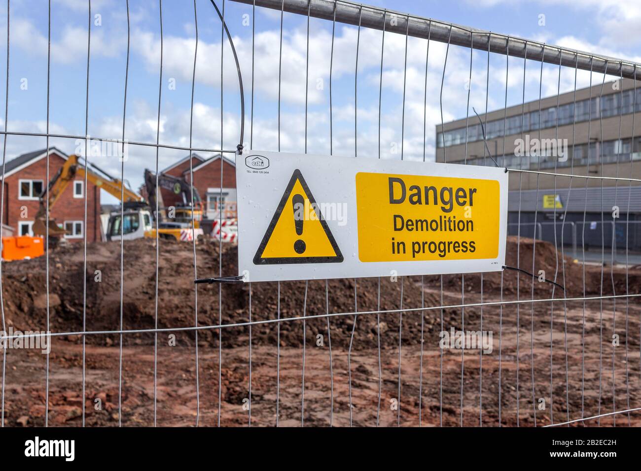 Warning sign for demolition in progress, housing development on