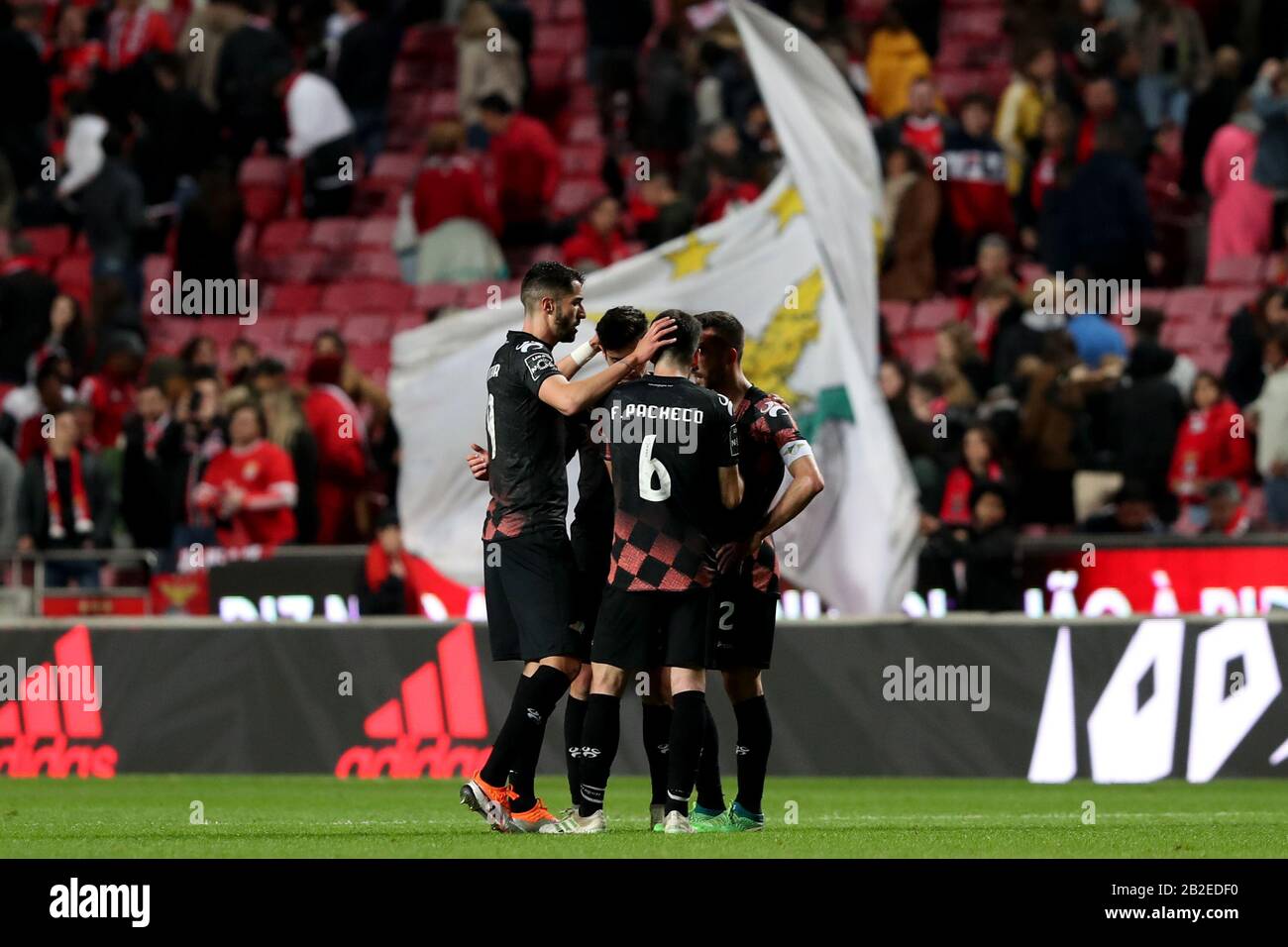 Lisbon, Portugal. 2nd Mar, 2020. Moreirense FC's players celebrate the tie after the Primeira Liga football match between SL Benfica and Moreirense FC in Lisbon, Portugal, on March 2, 2020. Credit: Petro Fiuza/Xinhua/Alamy Live News Stock Photo