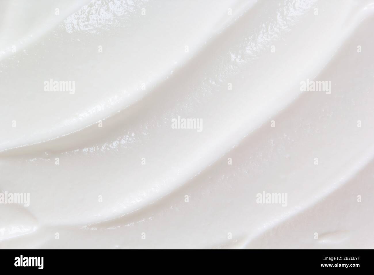 Sour cream, greek yogurt texture. White dairy product sample close up