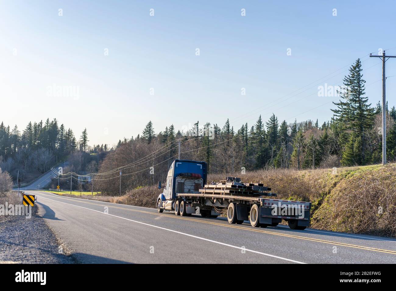 Industrial transportation Big rig blue classic semi truck with powerful