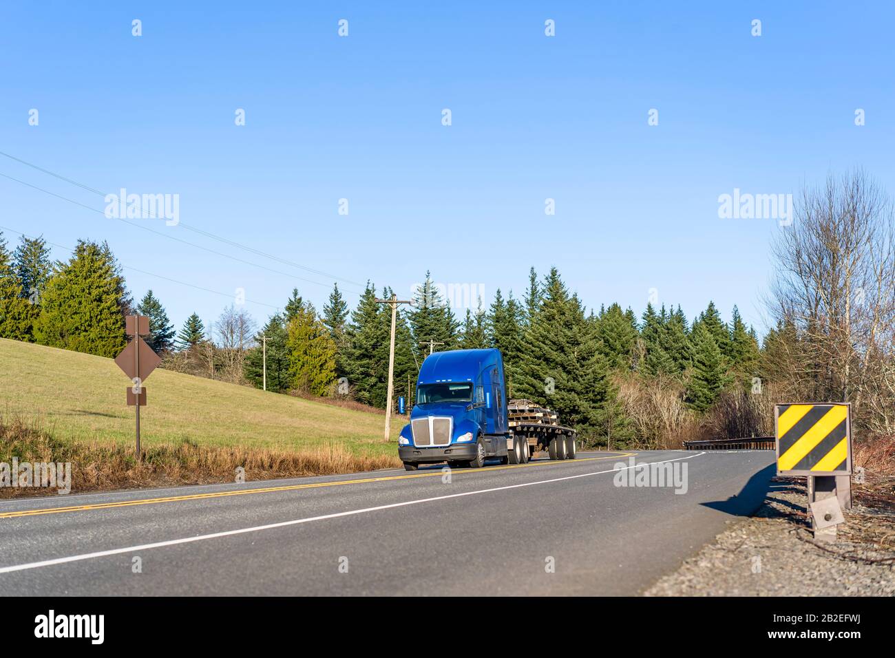 Industrial transportation Big rig blue classic semi truck with powerful ...