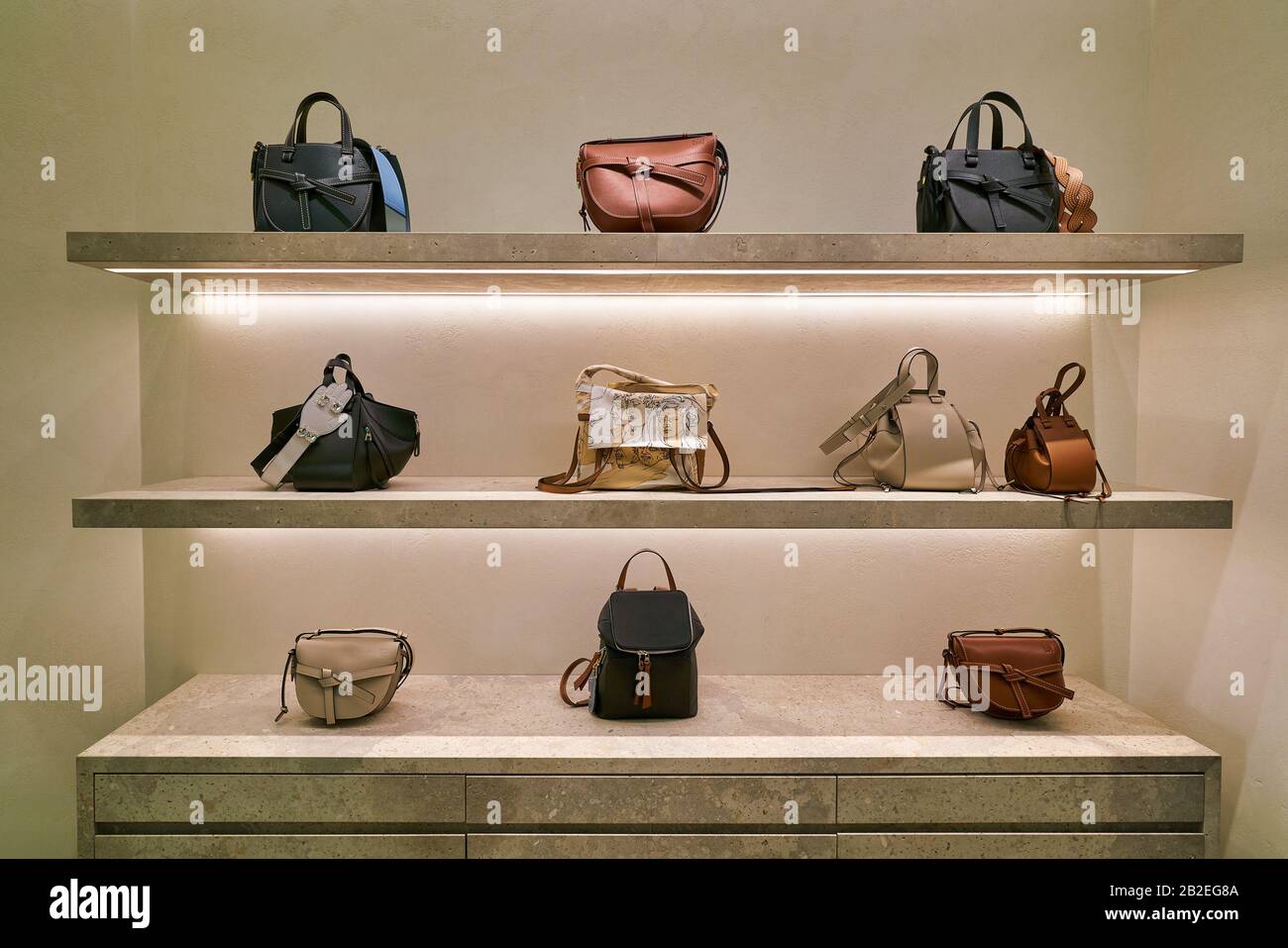 Luxury designer handbags on display in a Singapore shopping mall