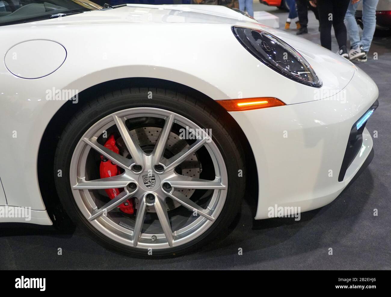 Philadelphia, Pennsylvania, U.S.A - February 9, 2020 - The side view and sports wheel of a 2020 Porsche 911 Carrera 4S in white color Stock Photo