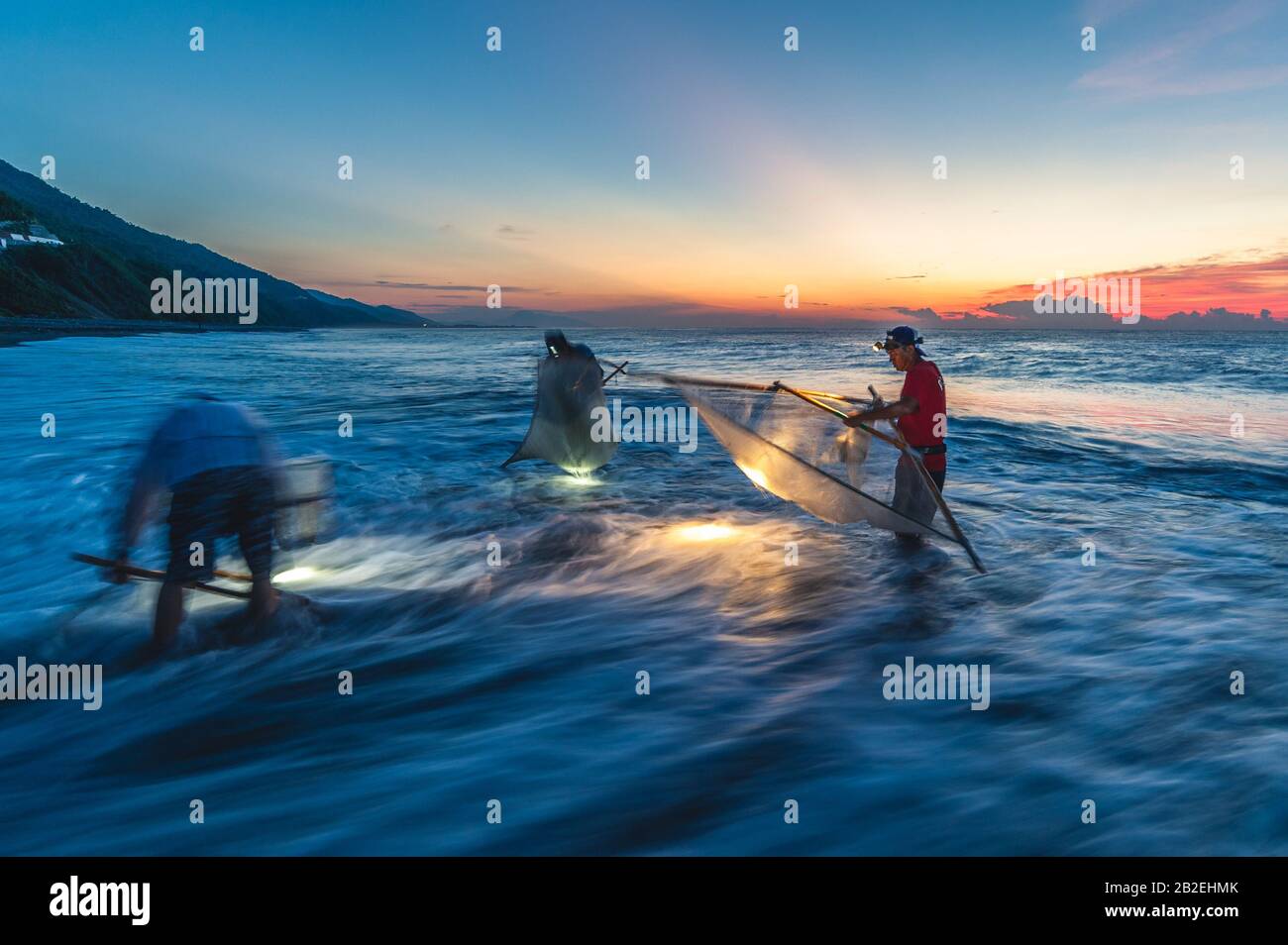 Taitung, Taiwan - July 31, 2016: traditional method to catch fish with triangle fishing net at the mouth of  jinlun river, taitung, taiwan. Stock Photo