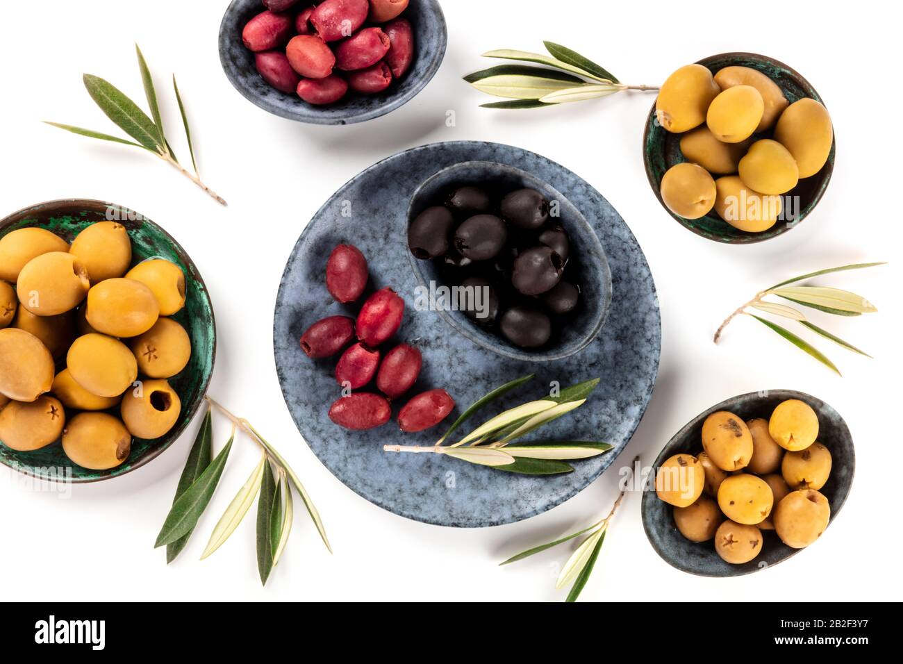 Olives, green, black and red, shot from the top on a white background Stock Photo