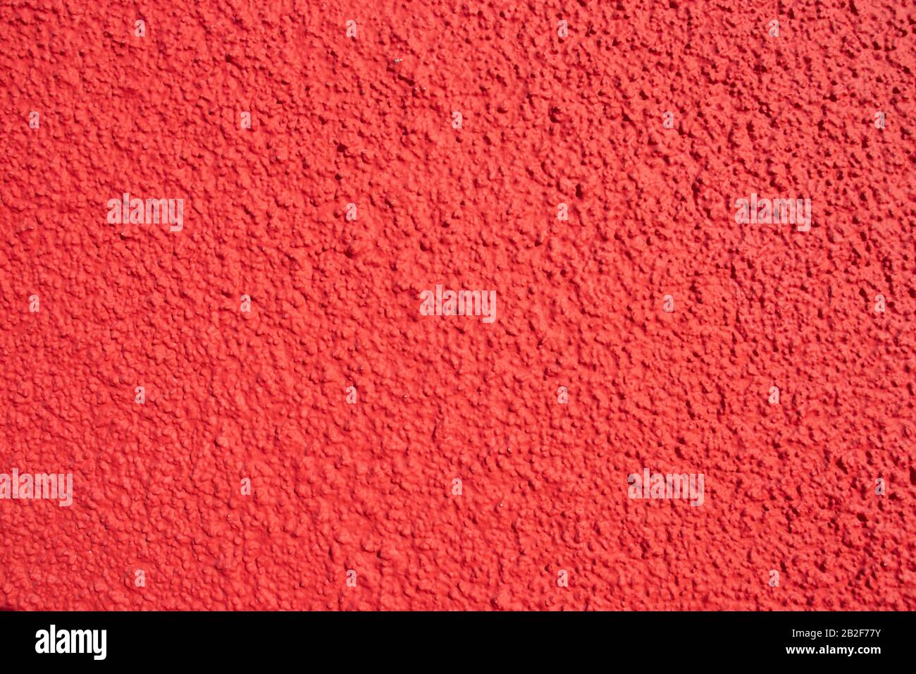 Textured grunge red wall background of a building Stock Photo