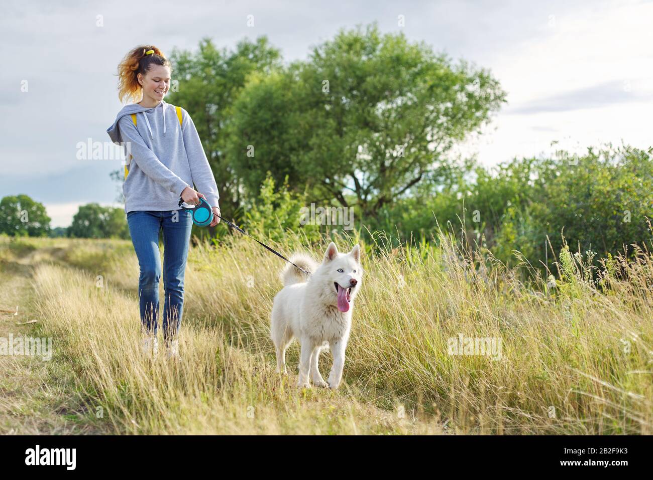 Teen walking dog hires stock photography and images Alamy