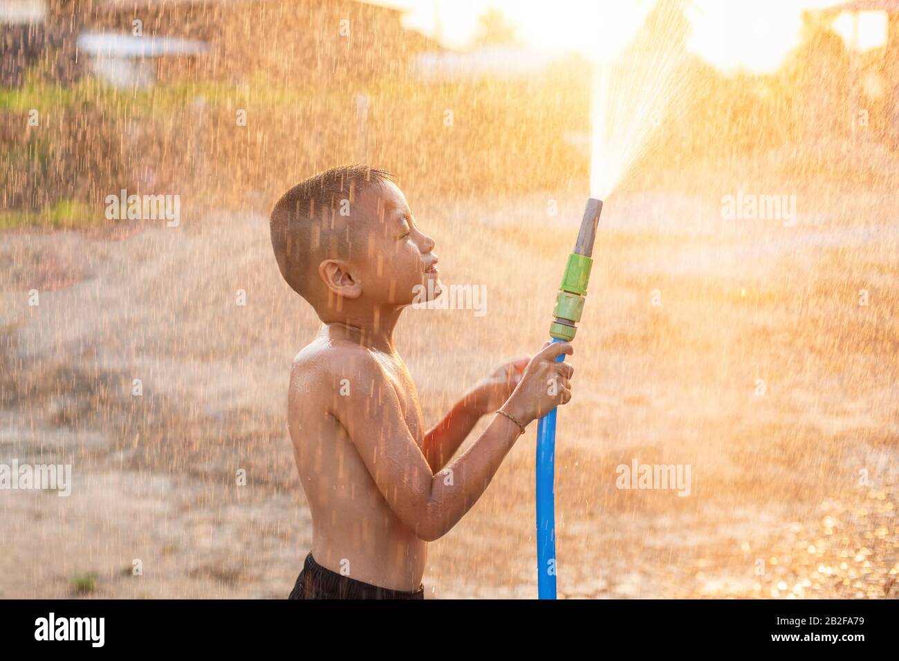 Teen boy with water Stock Photo by ©VaLiza 116935330