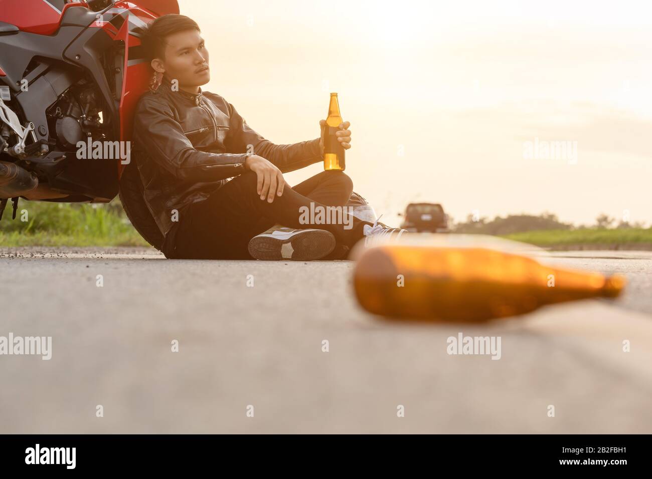 Biker drinking alcohol hires stock photography and images Alamy