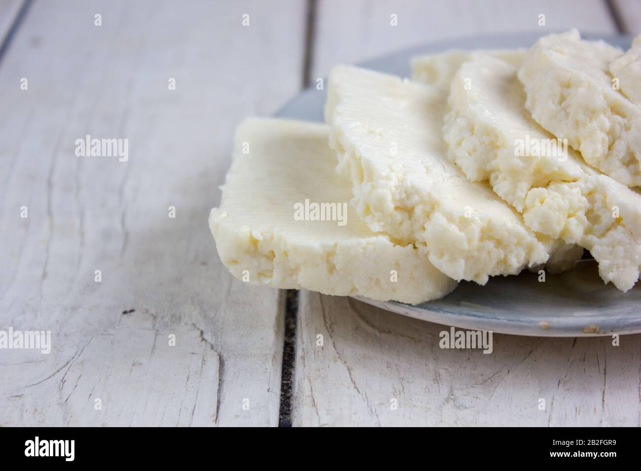 Traditional indian cheese panneer prepared form fresh milk on plate ...